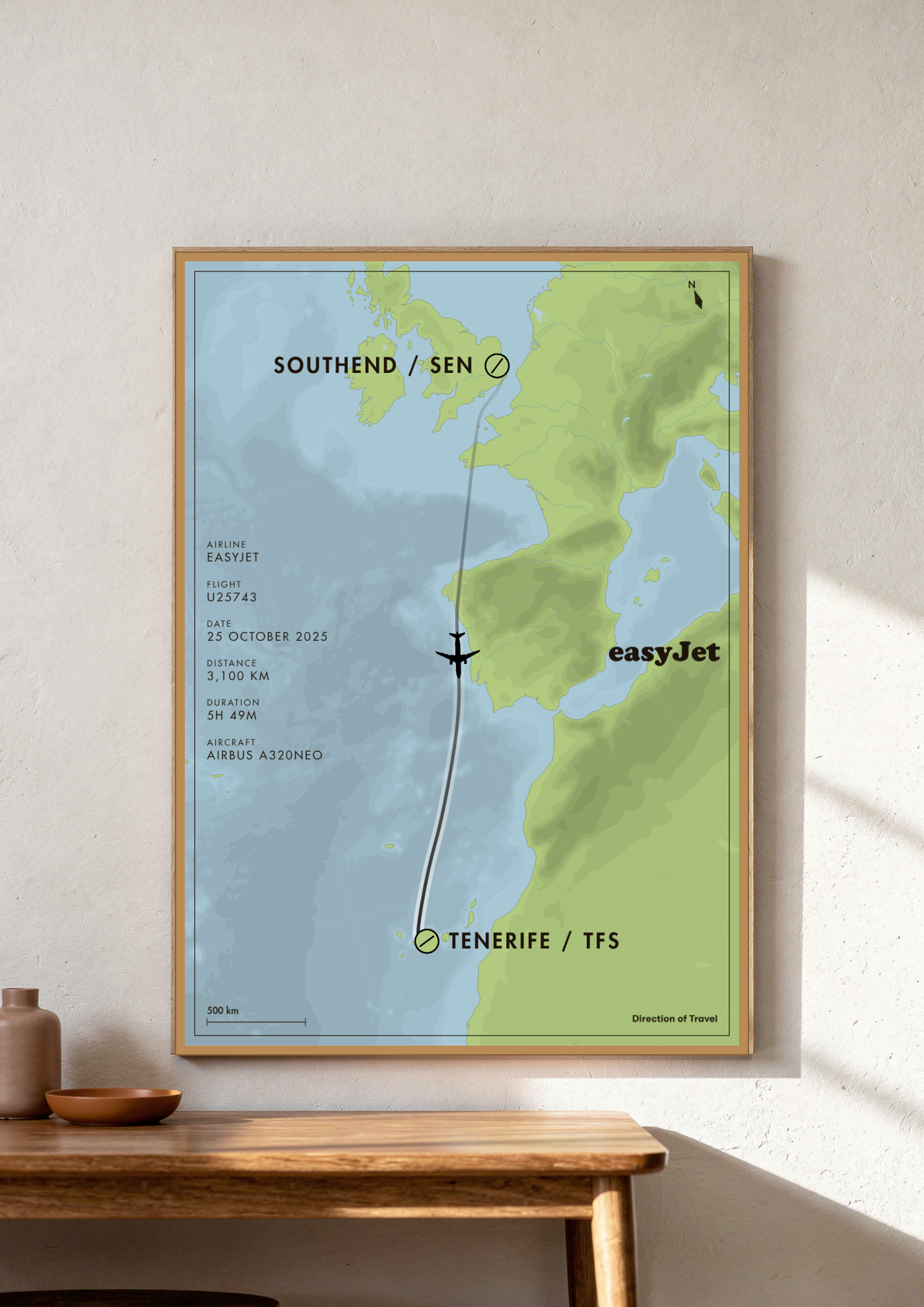 Southend to Tenerife A2 poster in a wooden frame in a room (AI-generated)