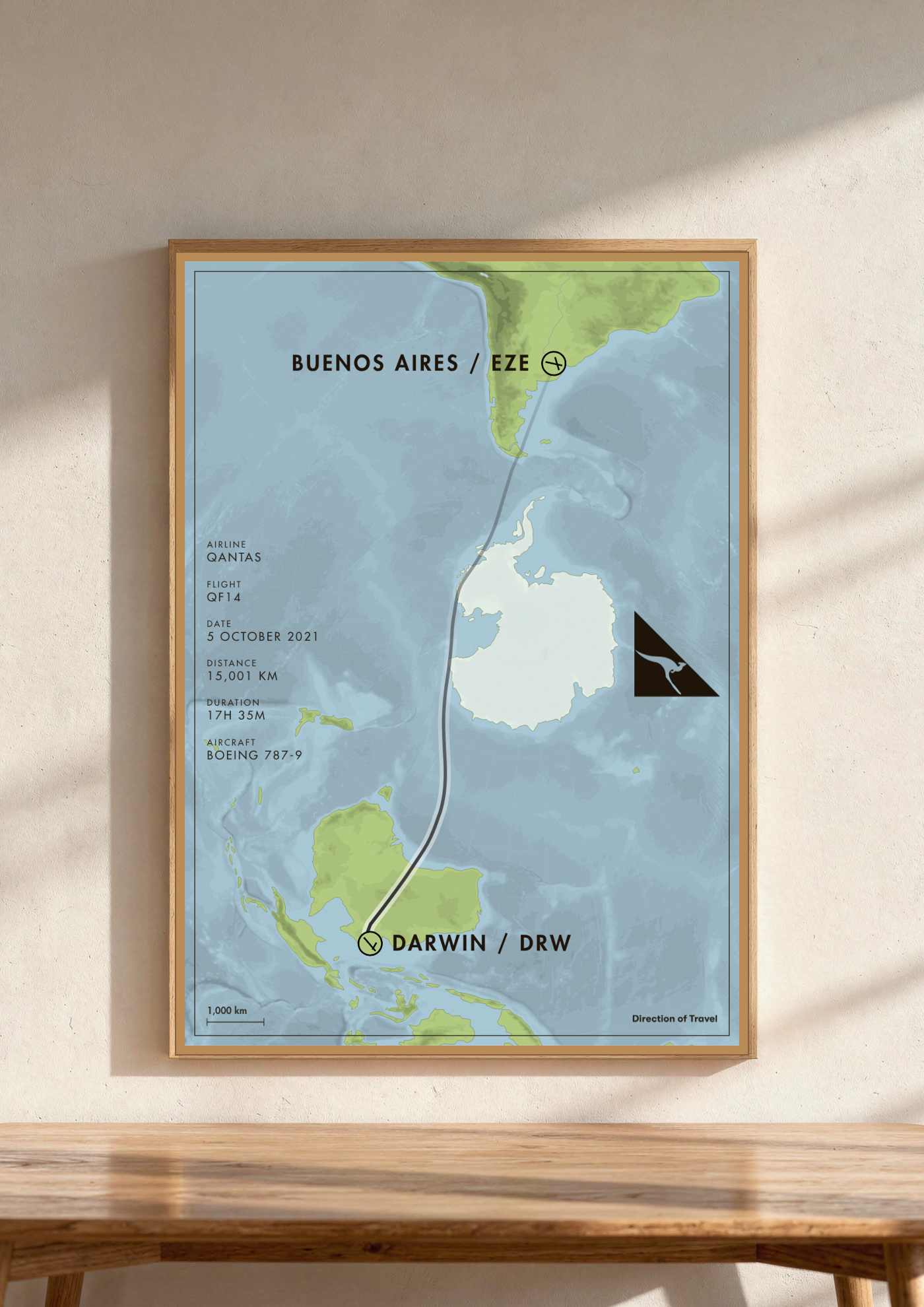 Buenos Aires to Darwin A2 poster in a wooden frame in a room (AI-generated)