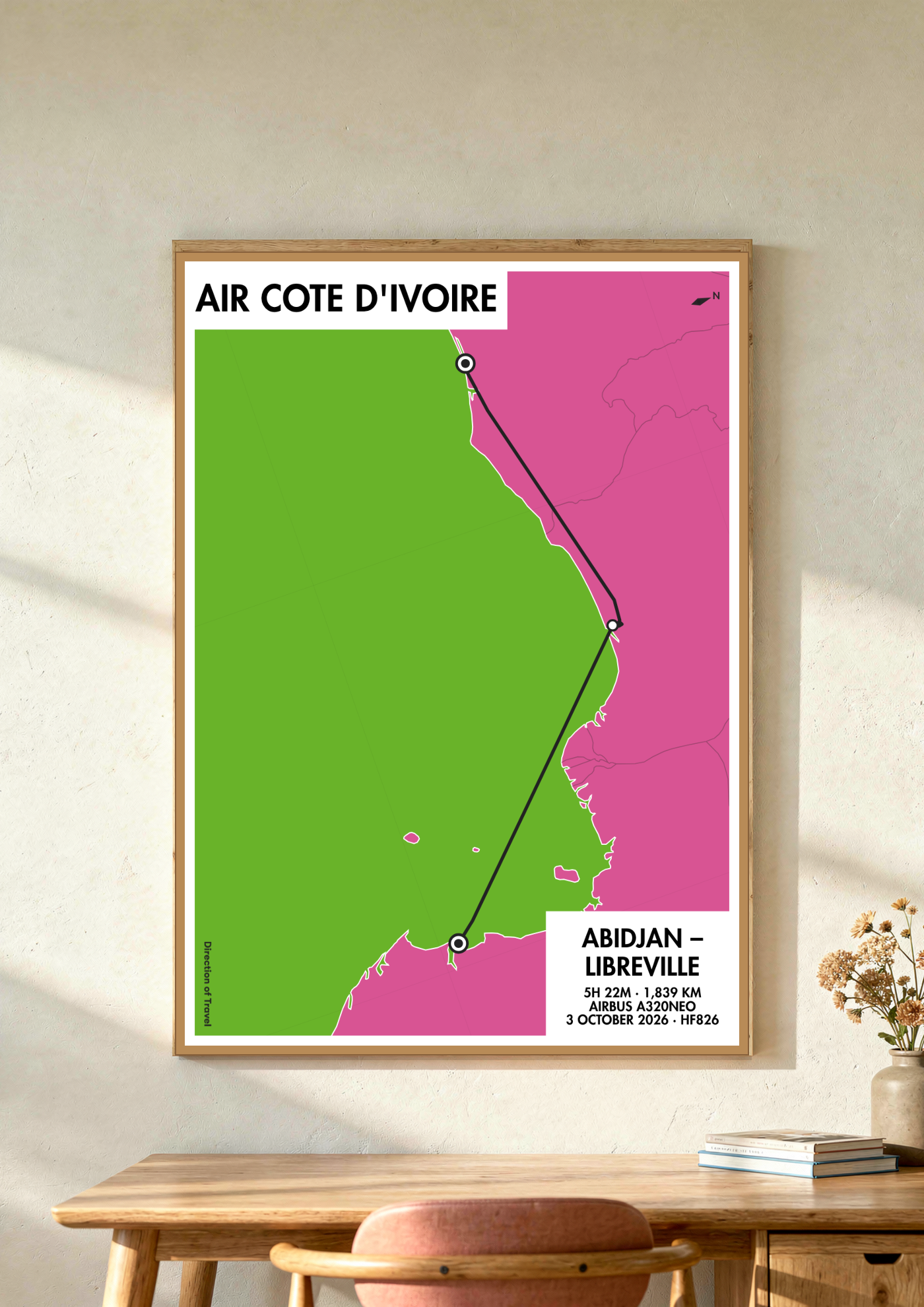 Abidjan to Libreville via LOS A2 poster in a wooden frame in a room (AI-generated)